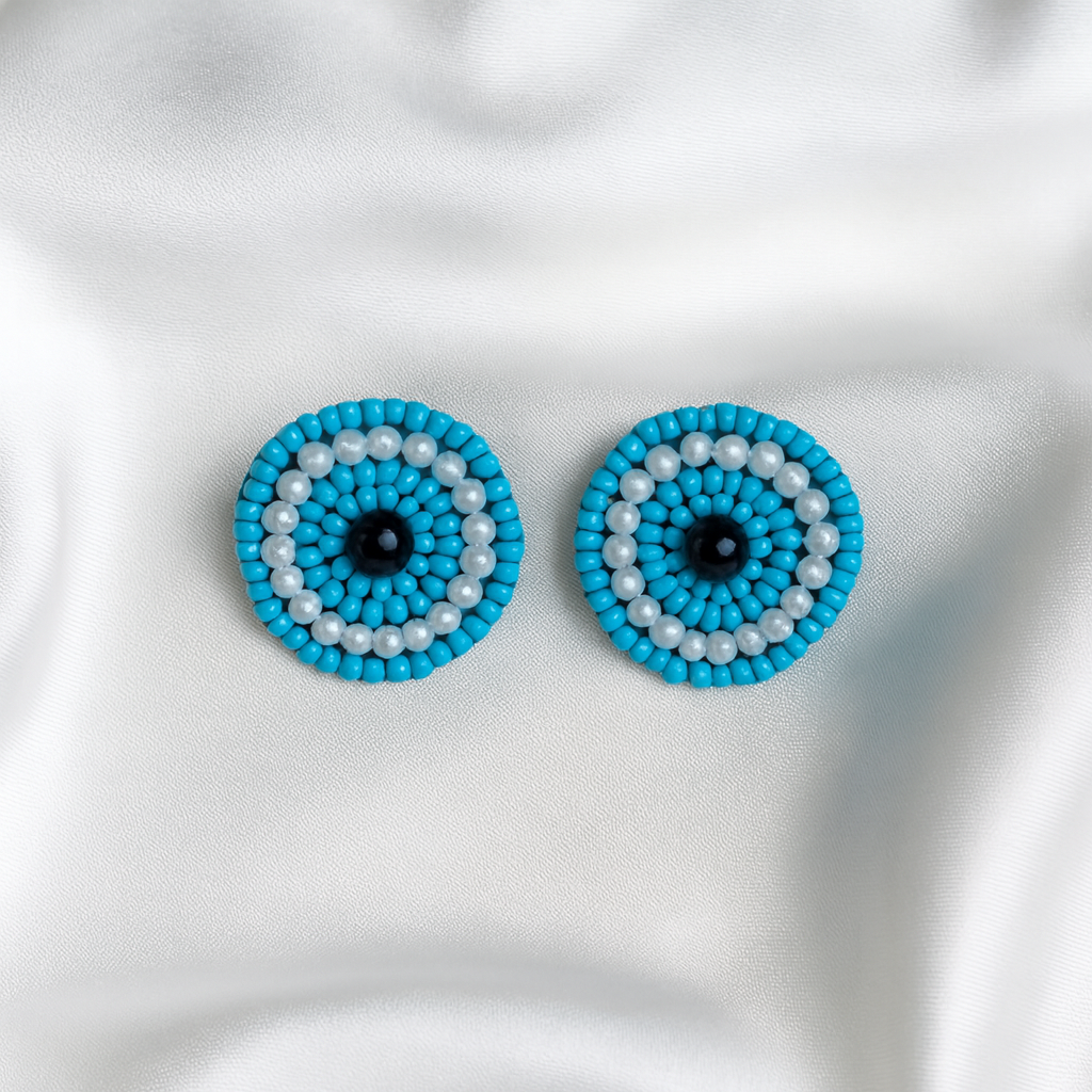 Handcrafted beaded blue earrings featuring the protective blue evil eye for style and positivity.