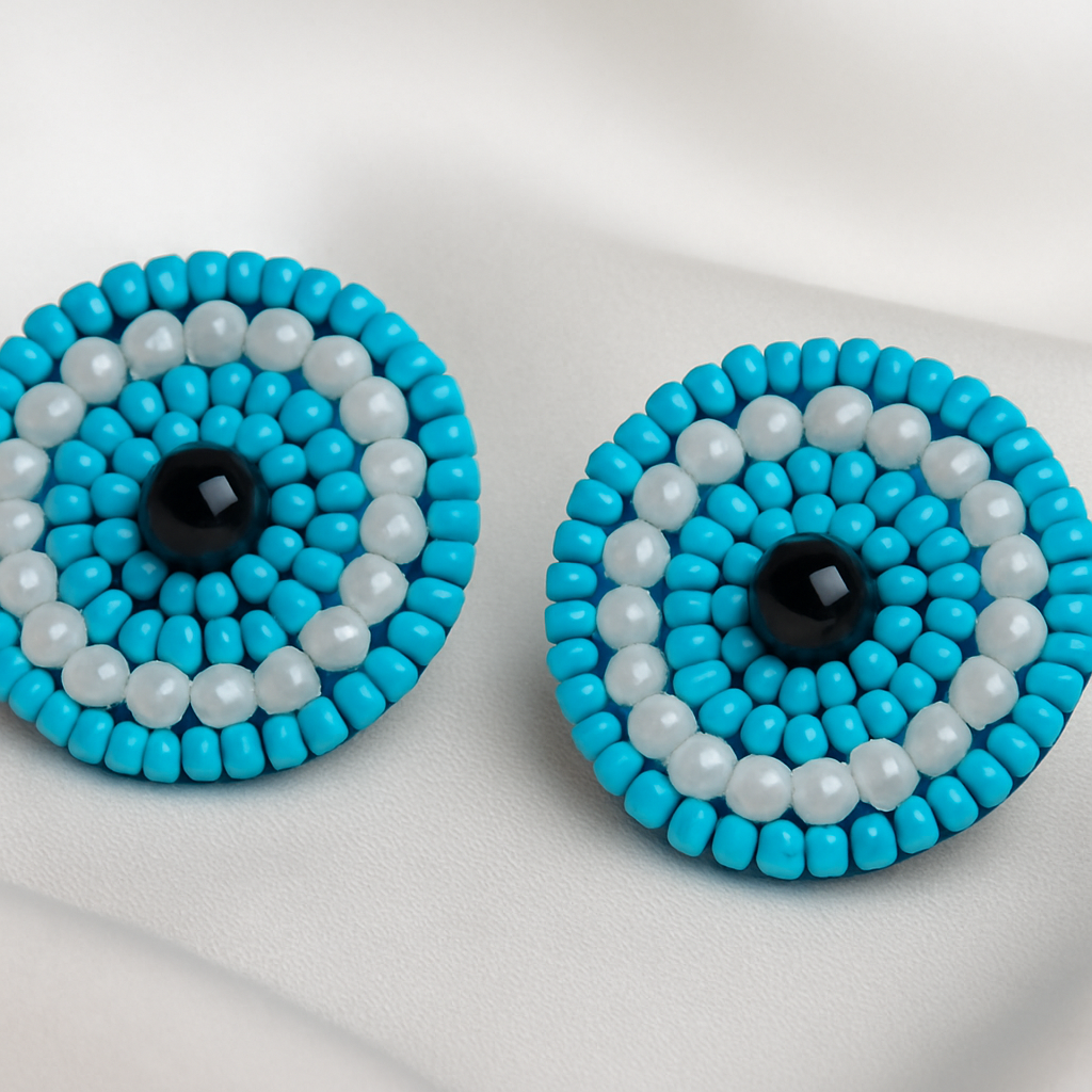 Handcrafted beaded blue earrings featuring the protective blue evil eye for style and positivity.